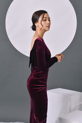 Velvet bodycon midi dress with long sleeves and deep V-back for evening sophistication